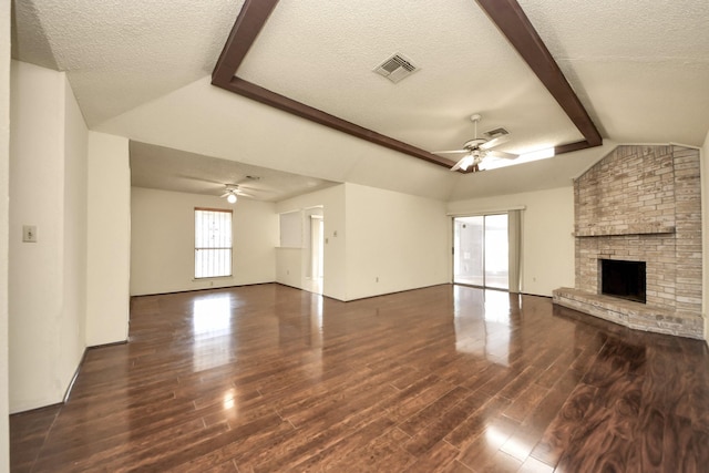 6643 Briar Glade Dr, Houston, TX 77072 - unfurnished living room featuring a ceiling fan, wood finished floors, a textured ceiling, and a brick fireplace
