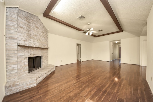 6643 Briar Glade Dr, Houston, TX 77072 - unfurnished living room featuring ceiling fan, wood finished floors, a textured ceiling, and a brick fireplace
