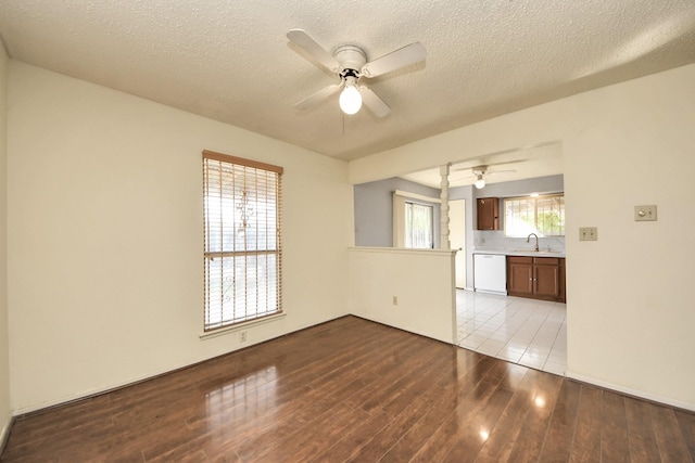 6643 Briar Glade Dr, Houston, TX 77072 - unfurnished room with ceiling fan, wood finished floors, and a textured ceiling