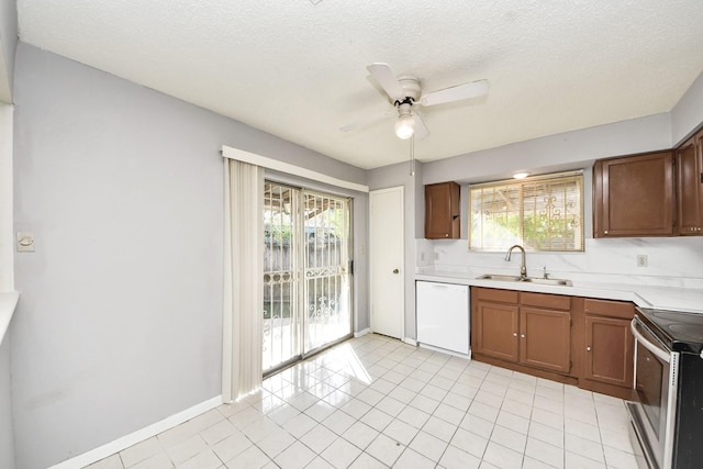 6643 Briar Glade Dr, Houston, TX 77072 - kitchen with dishwasher, stainless steel range with electric stovetop, light countertops, a ceiling fan, and healthy amount of natural light