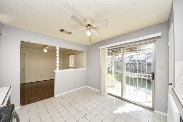 6643 Briar Glade Dr, Houston, TX 77072 - unfurnished room with ceiling fan, light tile patterned flooring, and a textured ceiling