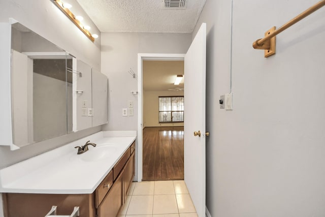 6643 Briar Glade Dr, Houston, TX 77072 - bathroom with vanity, a textured ceiling, and tile patterned flooring