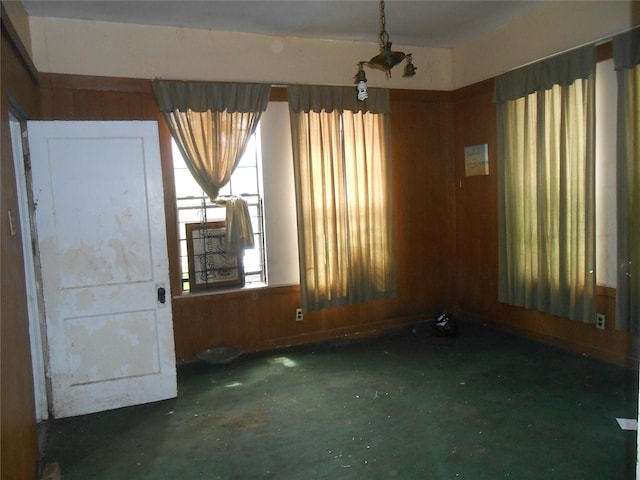 2214 Lee St, Houston, TX 77026 - empty room with concrete flooring and wooden walls