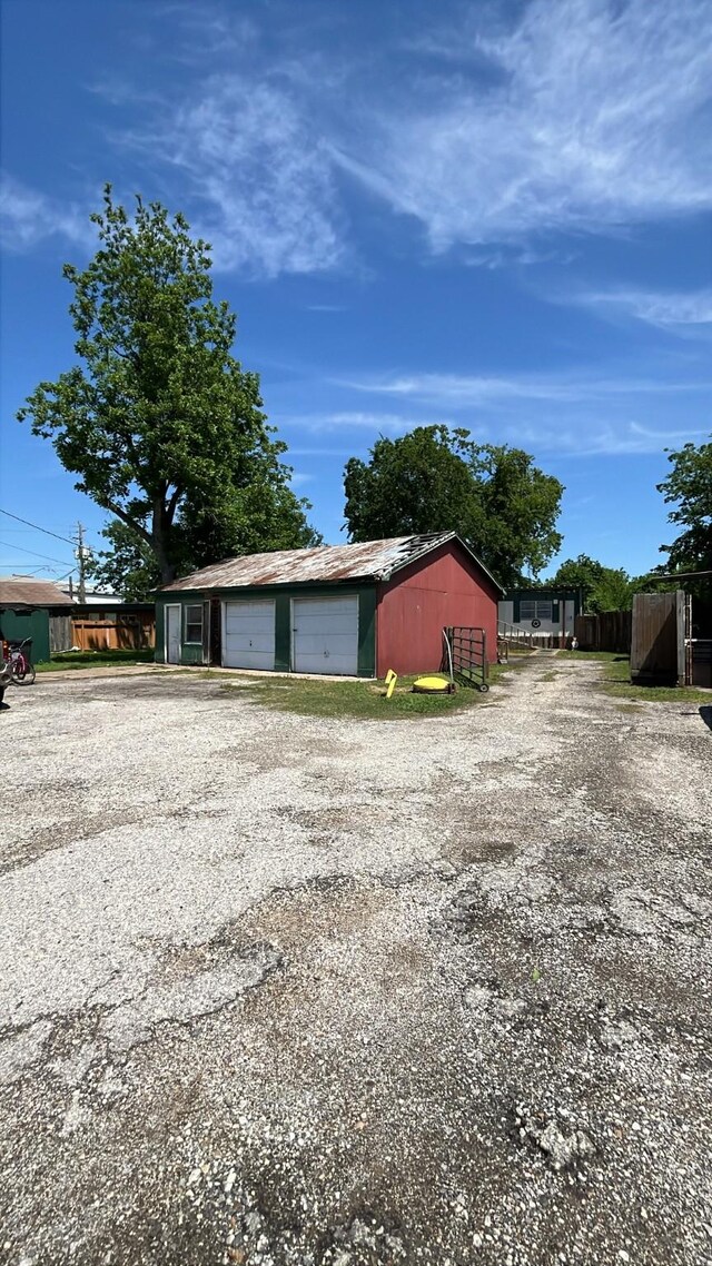 16305 De Zavalla Rd, Channelview, TX 77530 - detached garage with gravel driveway
