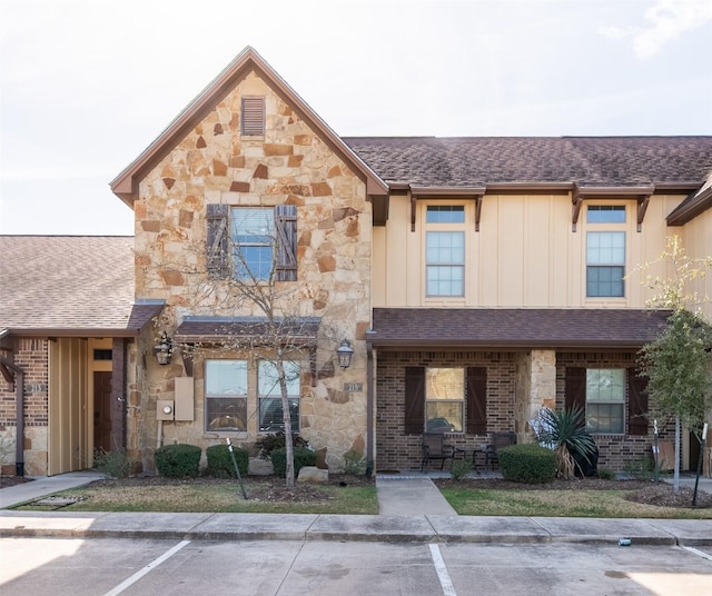 215 Capps Dr, College Station, TX 77845 - multi unit property with stone siding, uncovered parking, and board and batten siding