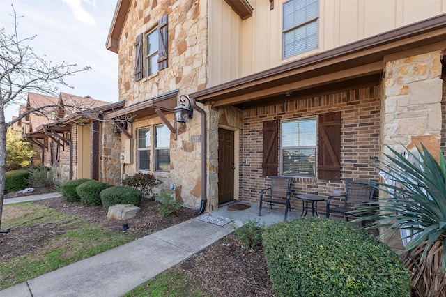 215 Capps Dr, College Station, TX 77845 - entrance to property with board and batten siding and stone siding