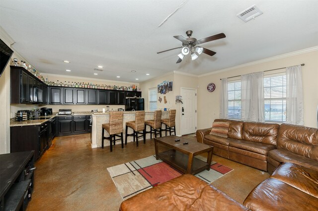 215 Capps Dr, College Station, TX 77845 - living area featuring a ceiling fan, crown molding, finished concrete flooring, and recessed lighting