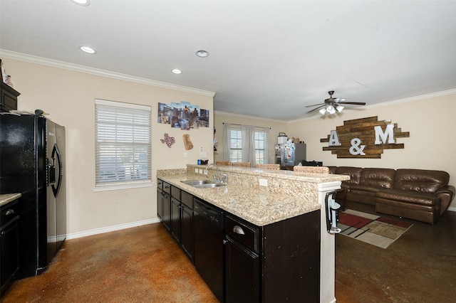 215 Capps Dr, College Station, TX 77845 - kitchen with black appliances, a peninsula, open floor plan, ceiling fan, and ornamental molding