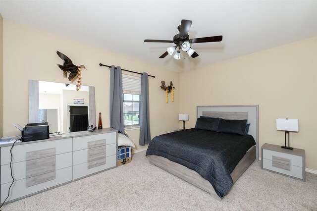 215 Capps Dr, College Station, TX 77845 - carpeted bedroom with baseboards and a ceiling fan