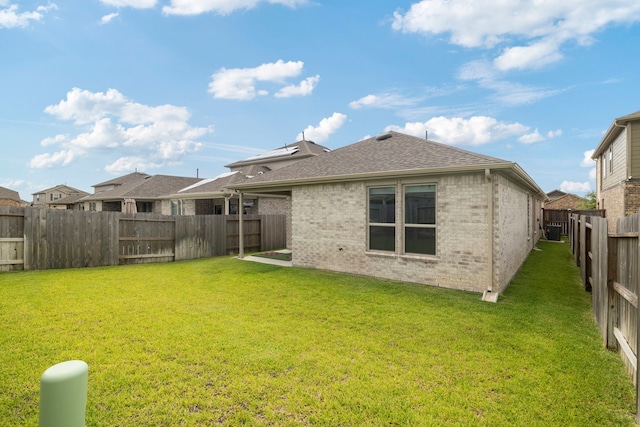 21127 Dolphin Bay Ln, Cypress, TX 77433 - back of house featuring brick siding, a fenced backyard, and a shingled roof