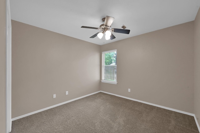 107 W Russet Grove Cir, The Woodlands, TX 77384 - carpeted spare room with baseboards and ceiling fan
