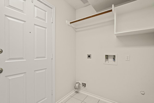 5003 Blanco Dr, Pearland, TX 77584 - laundry area with washer hookup, hookup for an electric dryer, gas dryer hookup, and light tile patterned floors