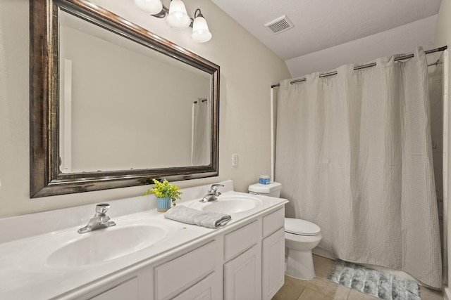 5003 Blanco Dr, Pearland, TX 77584 - bathroom with double vanity, tile patterned floors, lofted ceiling, and shower / tub combo with curtain