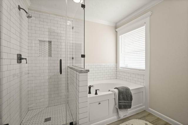 5003 Blanco Dr, Pearland, TX 77584 - full bathroom with crown molding, a garden tub, a shower stall, and wood finished floors