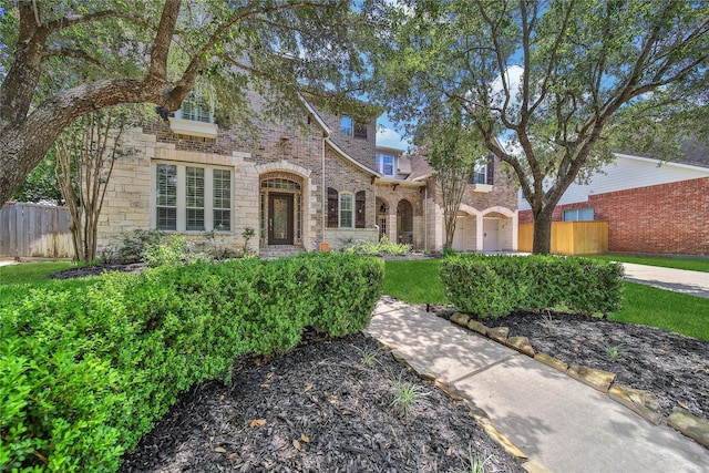 23815 Enchanted Xing, Katy, TX 77494 - english style home featuring stone siding and brick siding
