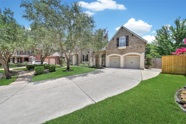 23815 Enchanted Xing, Katy, TX 77494 - traditional-style house featuring driveway, brick siding, and a garage