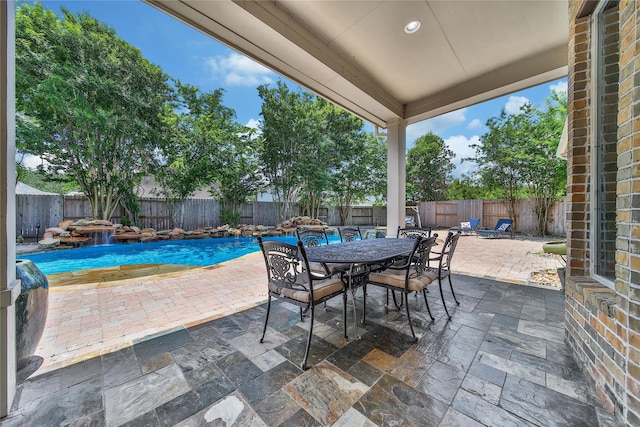 23815 Enchanted Xing, Katy, TX 77494 - fenced backyard featuring a patio and outdoor dining area