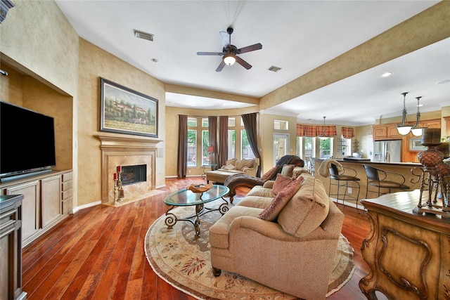 23815 Enchanted Xing, Katy, TX 77494 - living room with a premium fireplace, a ceiling fan, healthy amount of natural light, dark wood finished floors, and recessed lighting