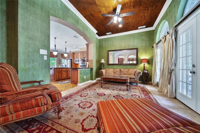 23815 Enchanted Xing, Katy, TX 77494 - living room featuring ornamental molding, a ceiling fan, arched walkways, light tile patterned floors, and wooden ceiling