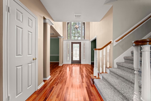 1808 Brookside Dr, Friendswood, TX 77546 - entrance foyer with stairs, wood finished floors, and a towering ceiling