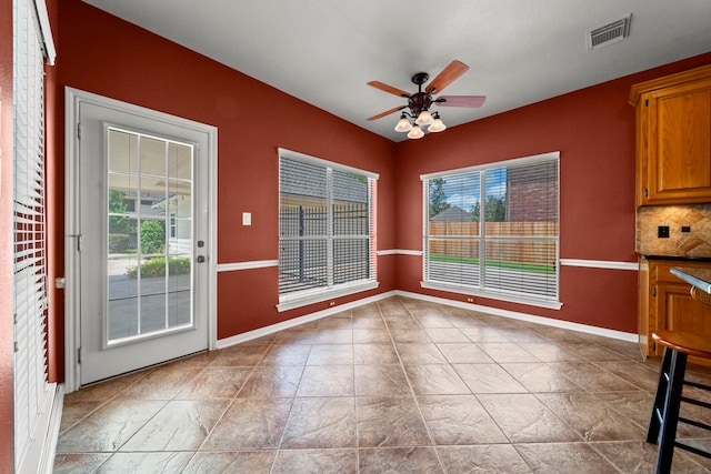 1808 Brookside Dr, Friendswood, TX 77546 - unfurnished dining area featuring ceiling fan and baseboards