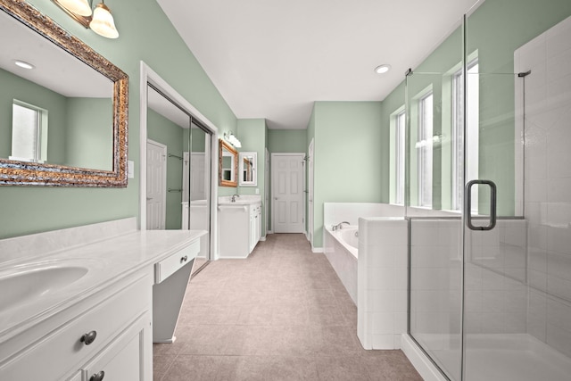 1808 Brookside Dr, Friendswood, TX 77546 - full bath with two vanities, a stall shower, a garden tub, and recessed lighting