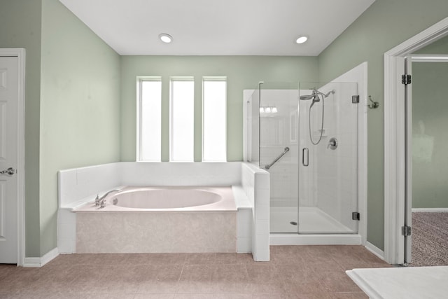 1808 Brookside Dr, Friendswood, TX 77546 - full bath featuring a garden tub, a shower stall, and tile patterned flooring