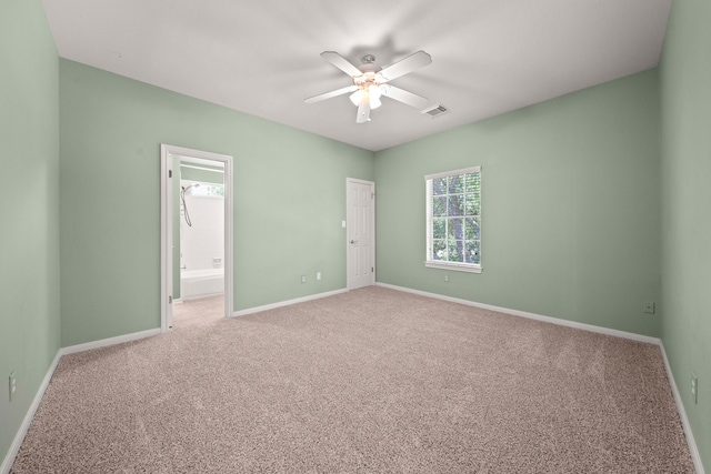 1808 Brookside Dr, Friendswood, TX 77546 - unfurnished bedroom with carpet, ensuite bathroom, and a ceiling fan