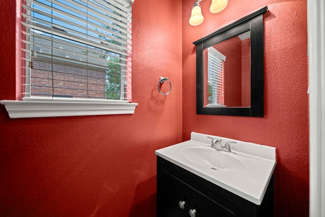 1808 Brookside Dr, Friendswood, TX 77546 - bathroom featuring a textured wall and vanity