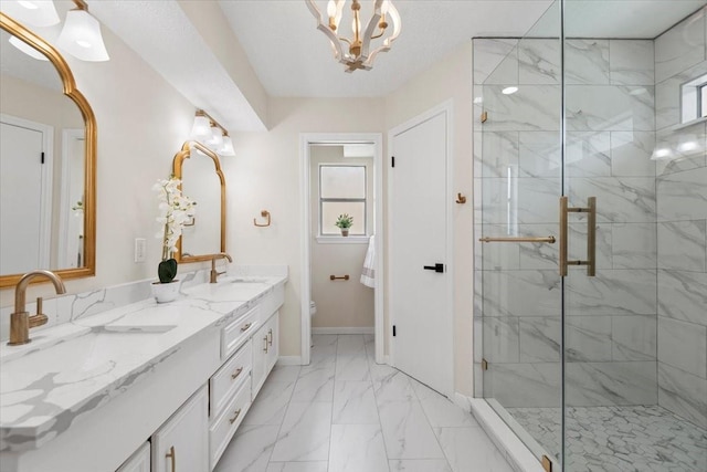 15502 Rana Ct, Houston, TX 77068 - bathroom featuring double vanity, a marble finish shower, marble finish floors, and a chandelier