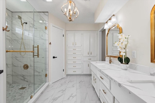 15502 Rana Ct, Houston, TX 77068 - bathroom featuring a marble finish shower, marble look tiles, vanity, and a chandelier