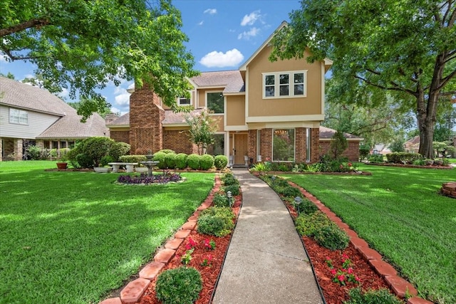 15502 Rana Ct, Houston, TX 77068 - view of front of home featuring a front lawn, stucco siding, and brick siding