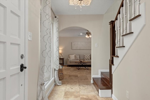 15502 Rana Ct, Houston, TX 77068 - entryway featuring arched walkways, stairs, and ceiling fan