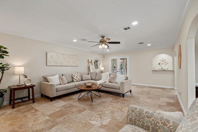 15502 Rana Ct, Houston, TX 77068 - living room with stone tile flooring, crown molding, ceiling fan, recessed lighting, and arched walkways