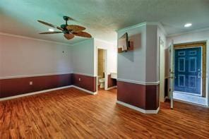 2884 W Fm 1988, Livingston, TX 77351 - empty room with crown molding, a ceiling fan, wood finished floors, and recessed lighting