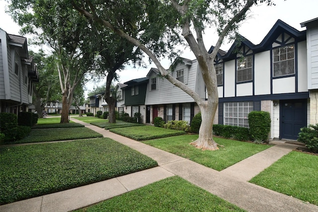 10018 Knoboak Dr Unit 21, Houston, TX 77080 - view of front of home featuring a residential view, a front yard, and brick siding