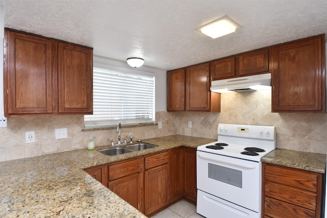 10018 Knoboak Dr Unit 21, Houston, TX 77080 - kitchen with electric range, under cabinet range hood, tasteful backsplash, and a textured ceiling