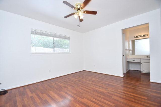 10018 Knoboak Dr Unit 21, Houston, TX 77080 - unfurnished bedroom with dark wood-type flooring, built in study area, and ceiling fan