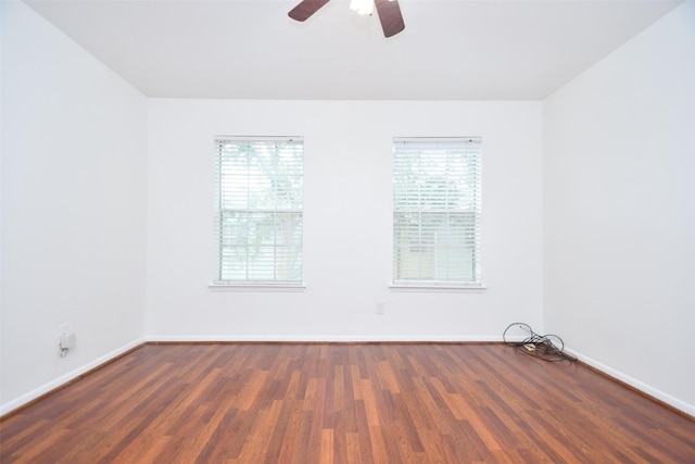 10018 Knoboak Dr Unit 21, Houston, TX 77080 - empty room featuring a ceiling fan and dark wood-style floors