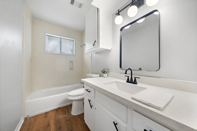 21710 Rotherham Dr, Spring, TX 77388 - bathroom with wood finished floors, vanity, and shower / washtub combination