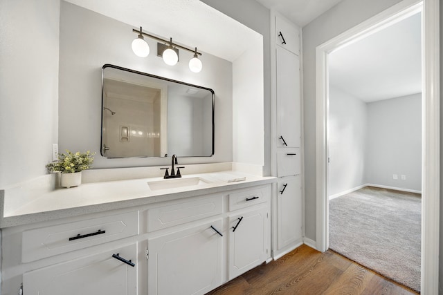 21710 Rotherham Dr, Spring, TX 77388 - bathroom with wood finished floors and vanity