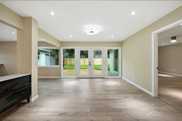 11726 Gardenglen Dr, Houston, TX 77070 - unfurnished living room featuring wood finished floors, french doors, and recessed lighting