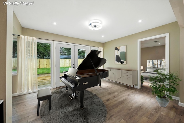 11726 Gardenglen Dr, Houston, TX 77070 - sitting room with french doors, light wood-style flooring, and recessed lighting