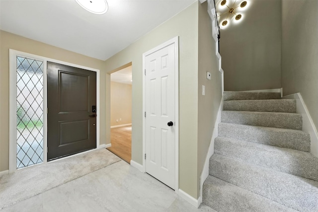 11726 Gardenglen Dr, Houston, TX 77070 - carpeted foyer with baseboards and stairway