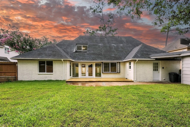 11726 Gardenglen Dr, Houston, TX 77070 - back of property with brick siding, a patio, and roof with shingles