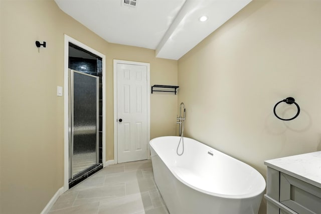11726 Gardenglen Dr, Houston, TX 77070 - full bath featuring a freestanding bath, a shower stall, vanity, and tile patterned floors