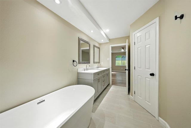 11726 Gardenglen Dr, Houston, TX 77070 - full bath featuring a soaking tub, double vanity, recessed lighting, ceiling fan, and tile patterned floors