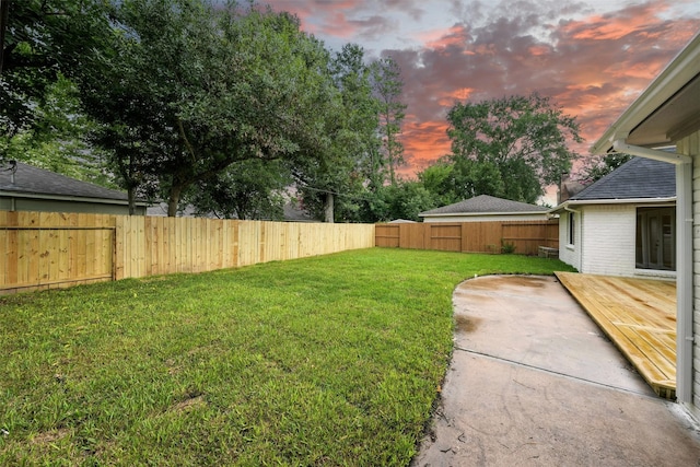 11726 Gardenglen Dr, Houston, TX 77070 - yard at dusk with a fenced backyard and a deck