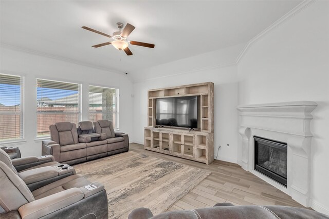 505 Ozark Ct, League City, TX 77573 - living room featuring ceiling fan, wood finished floors, ornamental molding, and a glass covered fireplace