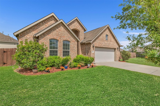 505 Ozark Ct, League City, TX 77573 - view of front facade with brick siding, concrete driveway, and a garage